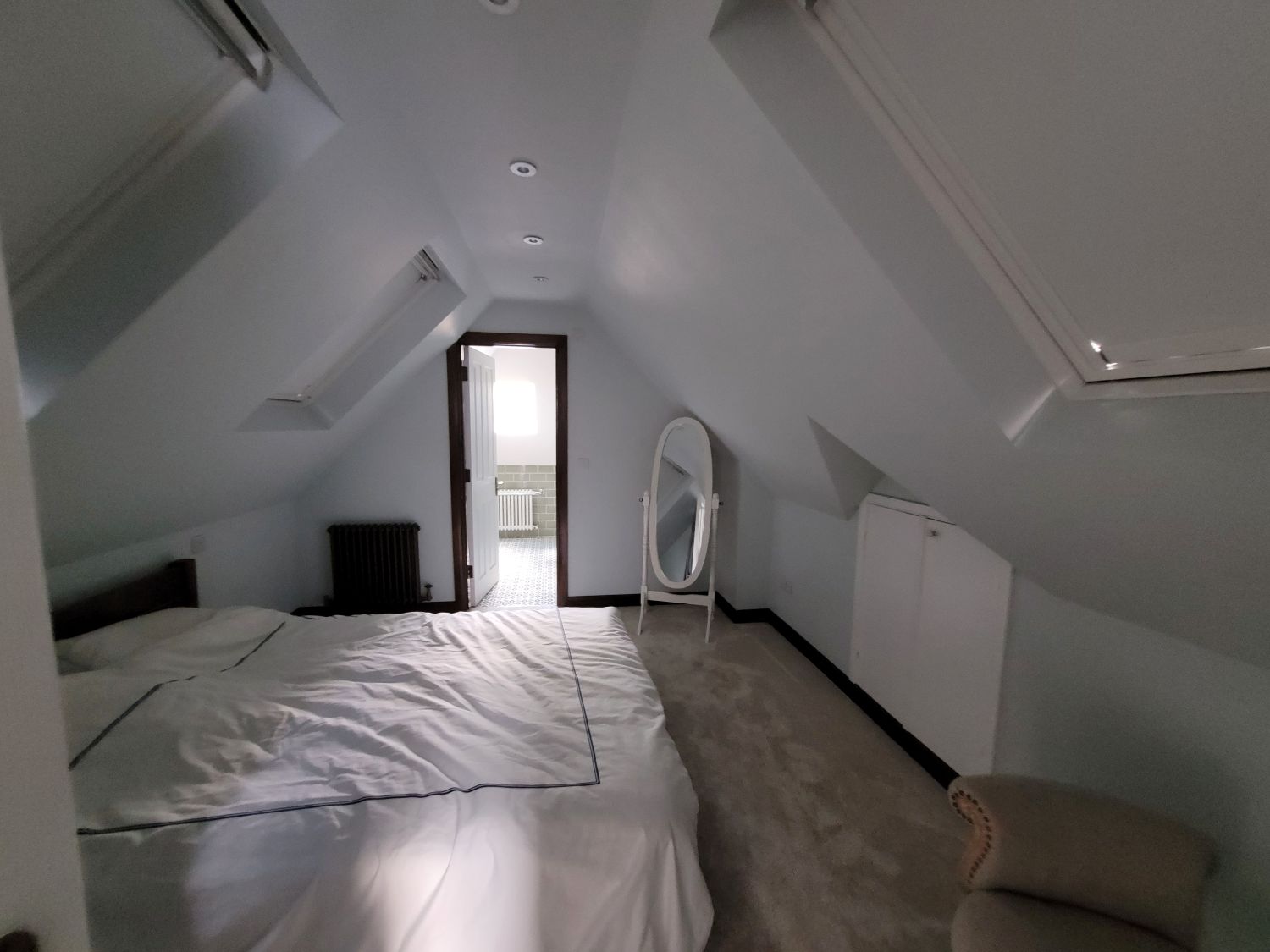 woking loft conversion bedroom leading to en-suite