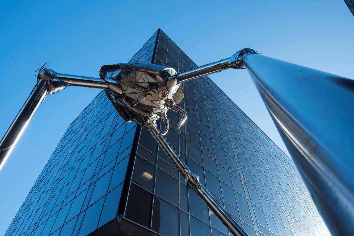 Woking HG Wells Martian sculpture with tall buildings Woking HG Wells-Martian sculpture with tall buildings