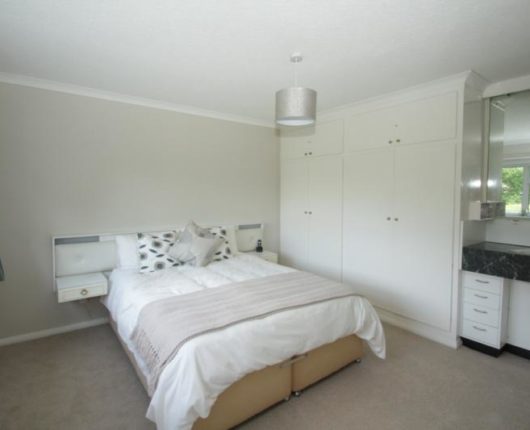 bedroom of 5 bed home before remodelling