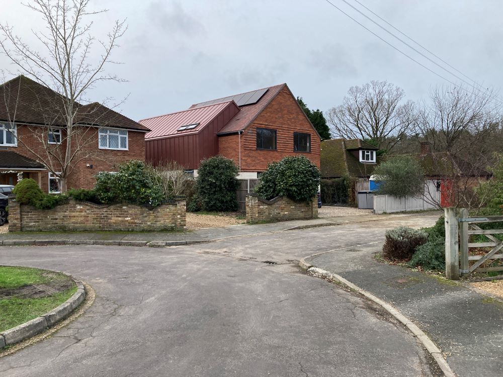 Convert a dormer bungalow into a stunning part zinc clad executive home - completed outside